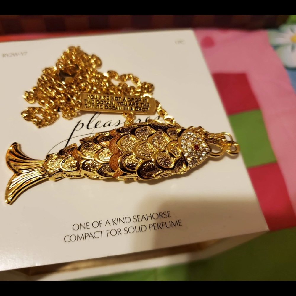 Estée Lauder fish necklace collectibles